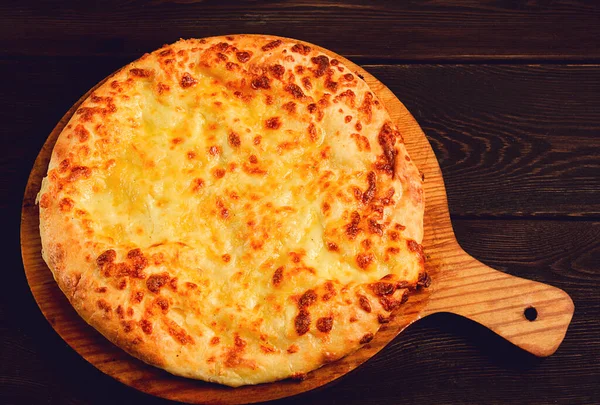 stock image Imereti khachapuri, Traditional Georgian dish, flatbread with cheese, top view, no people, rustic,