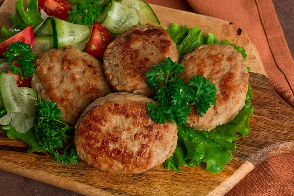 stock image Fried cutlets, turkey, with vegetable salad, top view, no people,