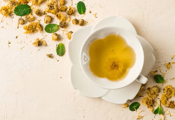 stock image Chrysanthemum tea, drink, white cup, mint, chrysanthemum buds, close-up, no people,