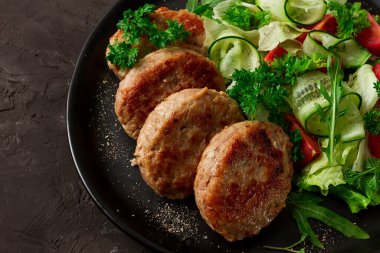 Fried cutlets, turkey, with vegetable salad, top view, no people,