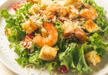 caesar salad, with shrimp, on a white background, homemade, no people,