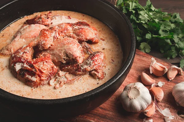 stock image Shkmeruli, fried chicken, in milk-garlic sauce, Georgian cuisine, homemade, close-up, no people,