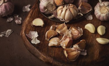 Fresh garlic, on a dark background, top view, food concept,