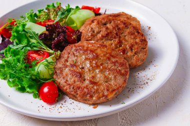 Fried cutlets, turkey, with vegetable salad, top view, no people,
