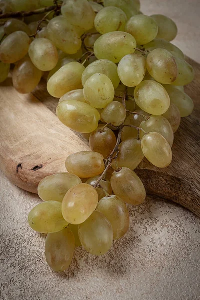 a branch of white grapes, wine grapes, Georgian grape variety Rkatsiteli, top view,