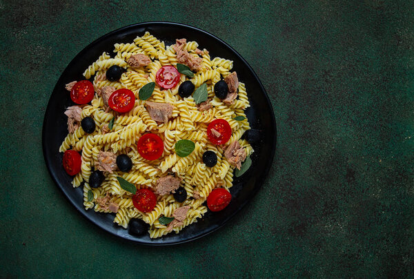 Tuna salad, fusilli pasta, olives and cherry, olive oil, homemade,