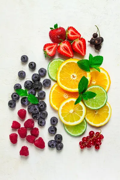 mix of fruits and berries,set, assortment, sliced citrus fruits, raspberries, blueberries, mint leaves, strawberries, red currants, food background, fruit wallpaper,