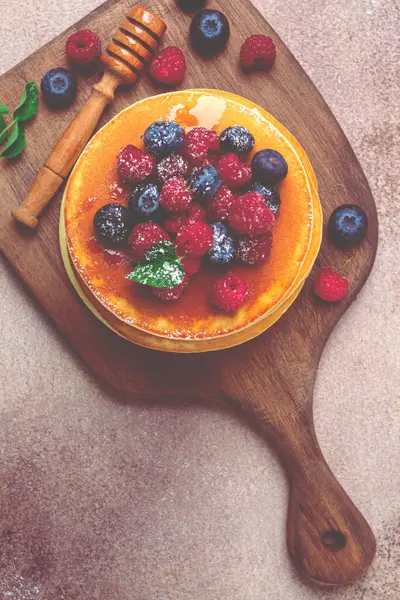 stock image Breakfast, pancakes with berries and honey, top view, homemade, no people, on a wooden background,