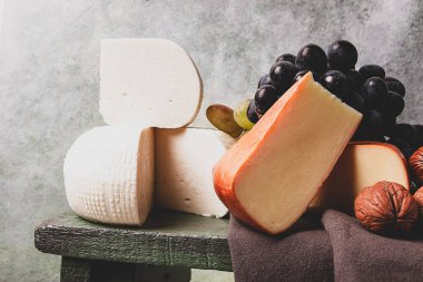 Georgian cheese, Imeretian and smoked suluguni, grapes, nuts, on a cutting board, Georgian cuisine, no people, clipart