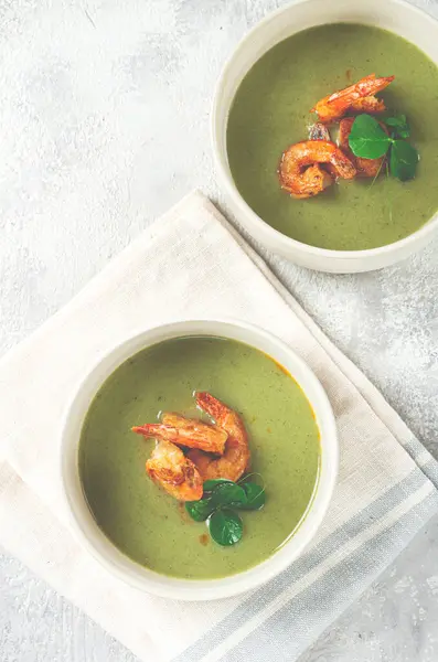 stock image pea cream soup, with shrimp, green soup, homemade, top view, no people,