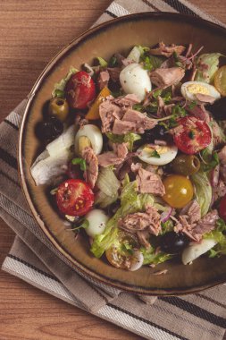 salad with canned tuna, vegetable salad with quail eggs, lettuce, red onion , cherry tomatoes , olives, keto food, healthy food, homemade, no people clipart