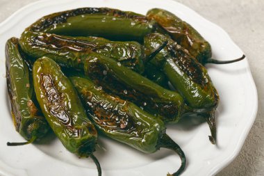 fried padron pepper, in a frying pan, with olive oil, and sea salt, homemade, no people. clipart