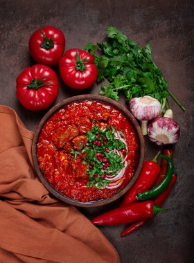 Chashushuli, a traditional Georgian dish, spicy, stewed meat with tomatoes and spices, homemade, no people, clipart