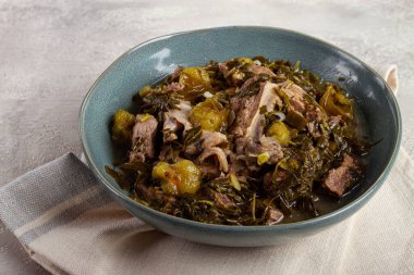 chakapuli, Georgian dish, stewed meat with herbs and tkemali, in white wine, homemade, no people, clipart