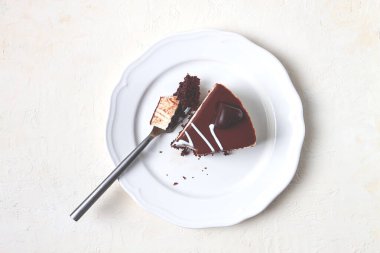 slice of cake, bird's milk, chocolate sponge cake with souffle, sweet dessert, on a white plate, close-up, horizontal, no people,