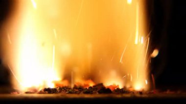 Flash of fire with sparks. Closeup Real Burning Background. Pyro, Glistening, sparkling, flash