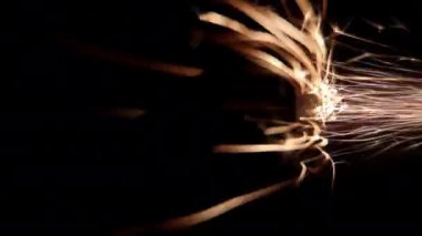 Closeup Real Firework Volcano Emitting Sparks on Dark Background, Pyro, Glistening, Particle Effect.