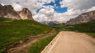 Hikers in mountains, beautiful scenic landscape of Alps, Passo San Pellegrino, North Italy
