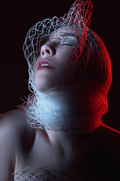 Girl Wrapped Net Red Light Hides Her Face — Stock Photo, Image