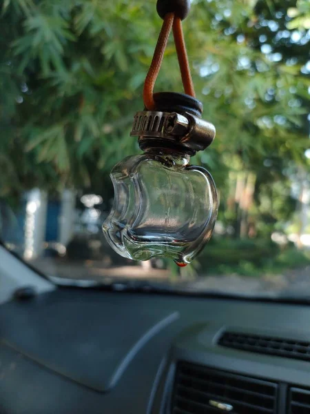 empty perfume bottle in the car
