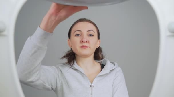 Confused Woman Opens Toilet Lid Looks Grimaces Unpleasant Smell Covers — Stock Video