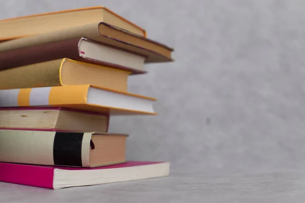 stock image stack of books on wooden table