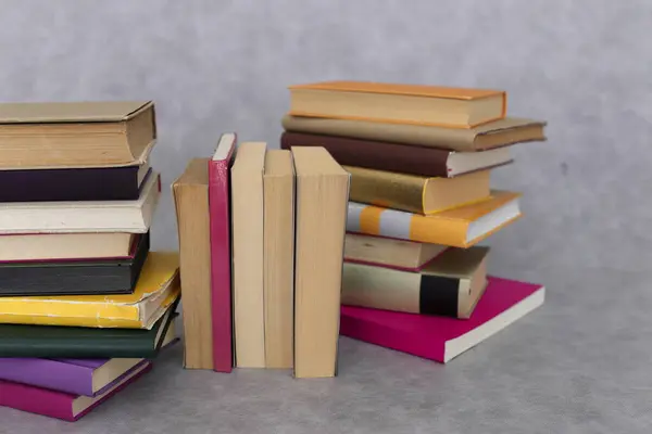 stock image stack of books on wooden table