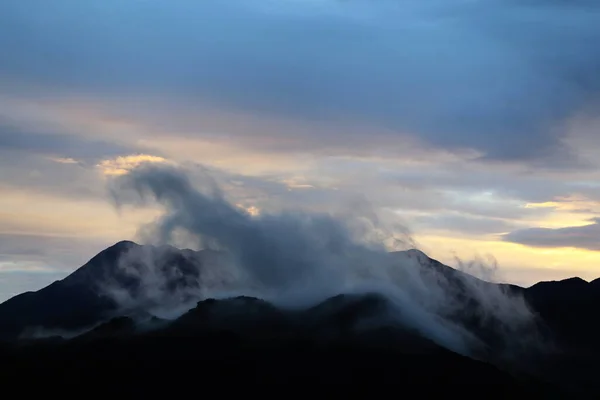 stock image Fog covers the mountain tops