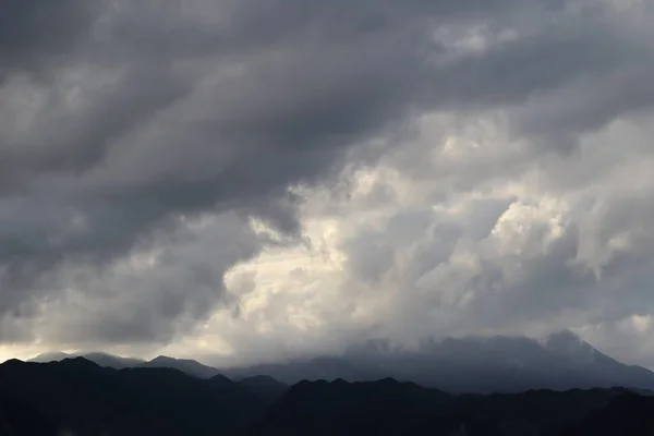 stock image beautiful clouds in the mountains