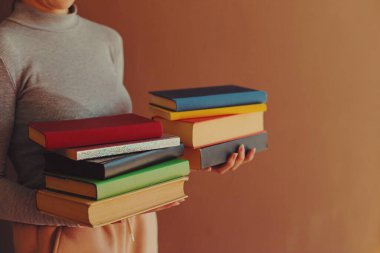 stack of books and book on a white background