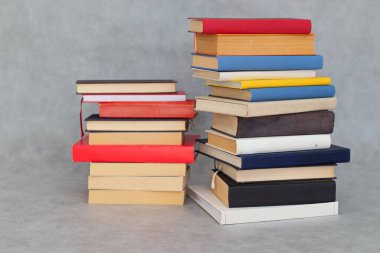 stack of open book on a wooden background