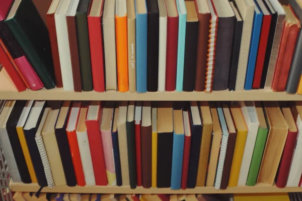 Stock image stack of books on wooden table