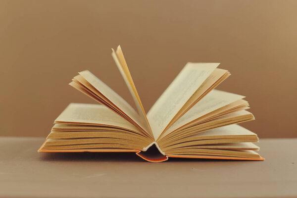 Open book on wooden background