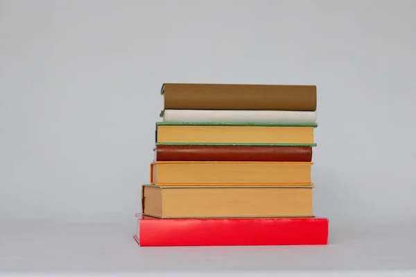 stock image pile of books and bookshelves in library, closeup