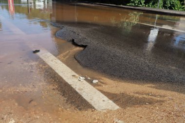 asphalt road with rain drops