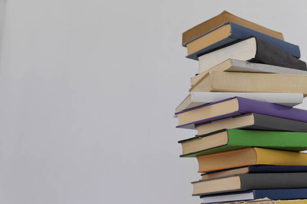 stack of different books on white background