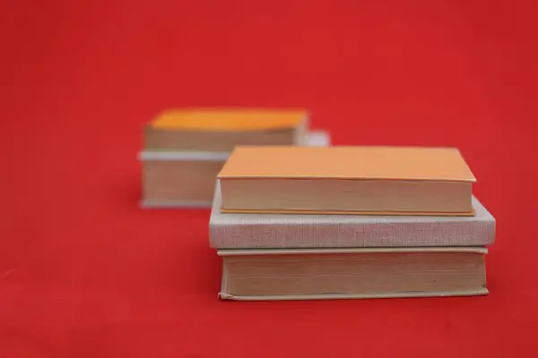 pile of books in front of white background