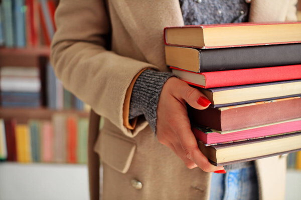woman in library with books