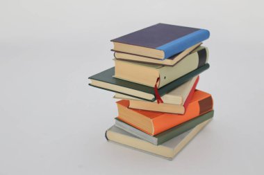 stack of books on white background, Isolated books on a white background, a set of books by the world's best writers, photo illustration for literature, science, science, learning, studying, history, education clipart