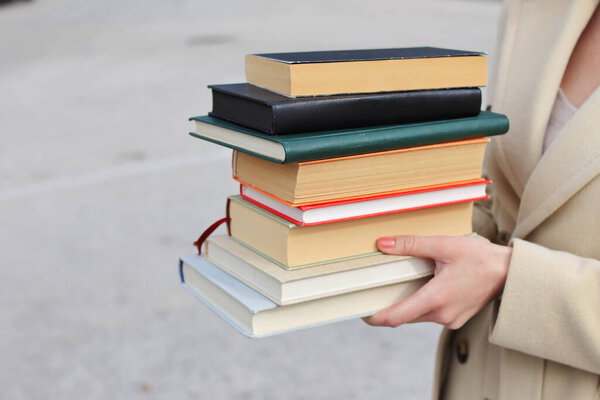 woman with red leather bag and books,Young beautiful girl holding books in her hand, set of books of the world's best writers, illustration for literature, science, science, learning, studying, history, education, art