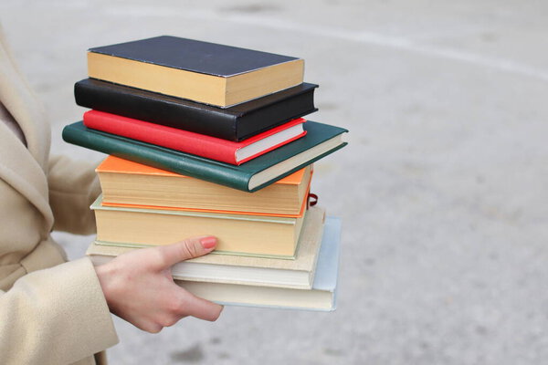 woman with red leather bag and books,Young beautiful girl holding books in her hand, set of books of the world's best writers, illustration for literature, science, science, learning, studying, history, education, art