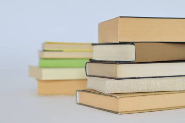 books on the table in front of a white background clipart