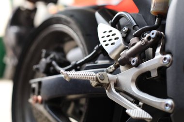 a closeup shot of a red and white toy motorcycle, a red motorcycle on a white background
