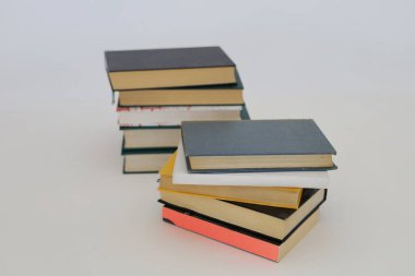  stack of books on wooden table against blurred background. space for text, Red books on the table, education, reading,learning, studying, knowledge, literature,education background, Romance novel, collection of poems, High quality photos of books clipart