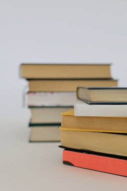  stack of books on wooden table against blurred background. space for text, Red books on the table, education, reading,learning, studying, knowledge, literature,education background, Romance novel, collection of poems, High quality photos of books clipart