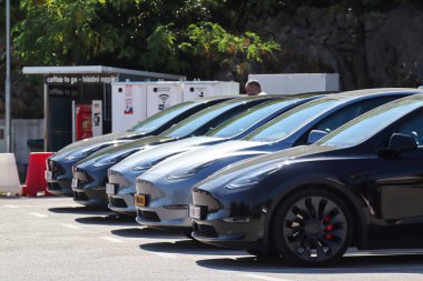 Vrgorac, Croatia, 05.10.2025. Tesla electric car charging in the parking lot
