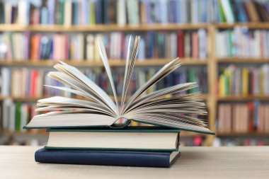 stack of books on table in library, closeup