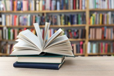 stack book on wooden table in library