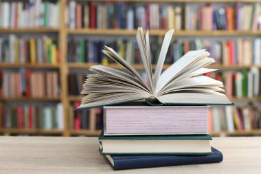 books and a stack of colorful wooden table