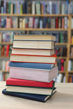 stack of books on the shelf, library background